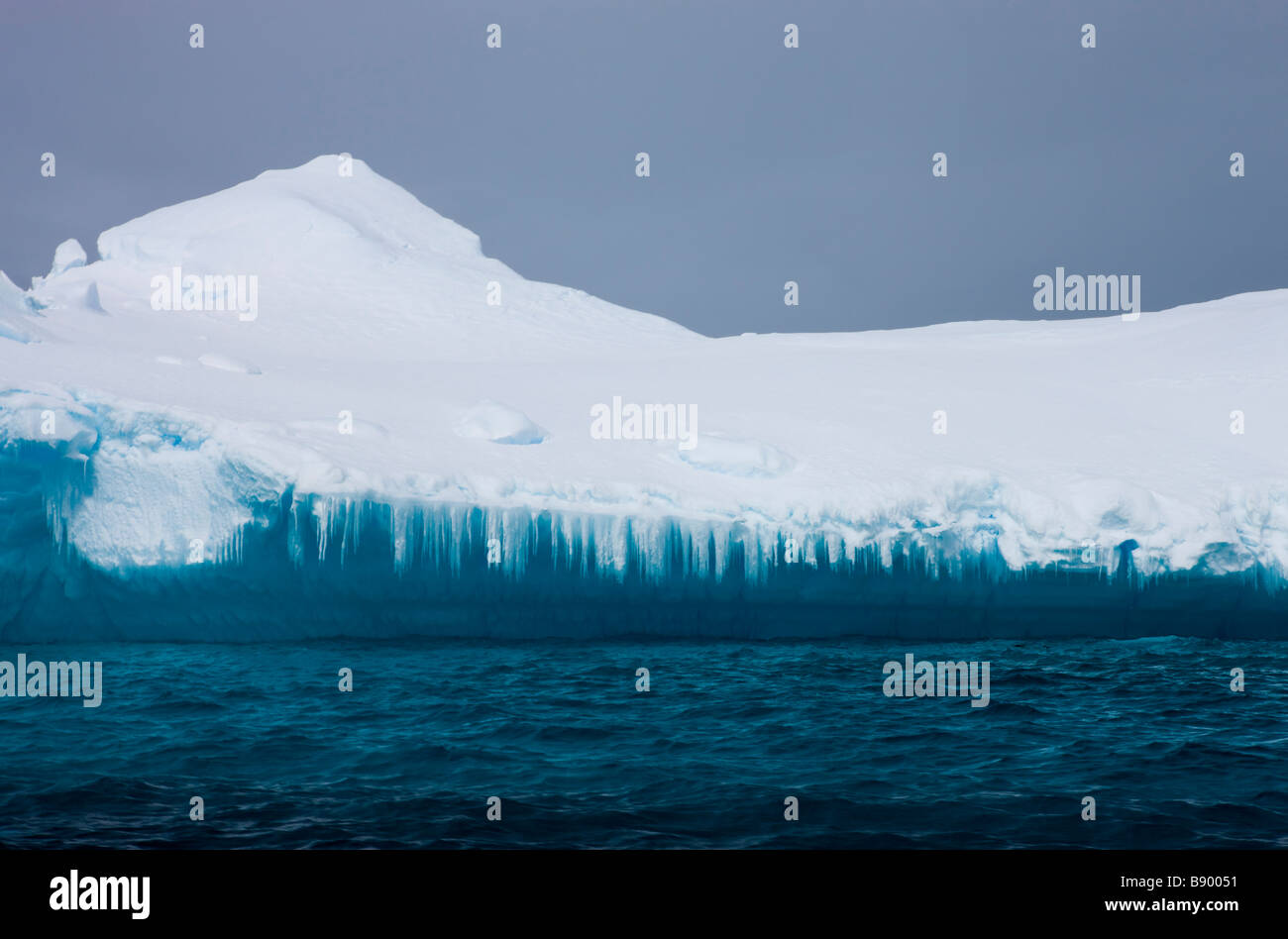 Melting facade of an iceberg Antarctic Peninsula Antarctica Stock Photo