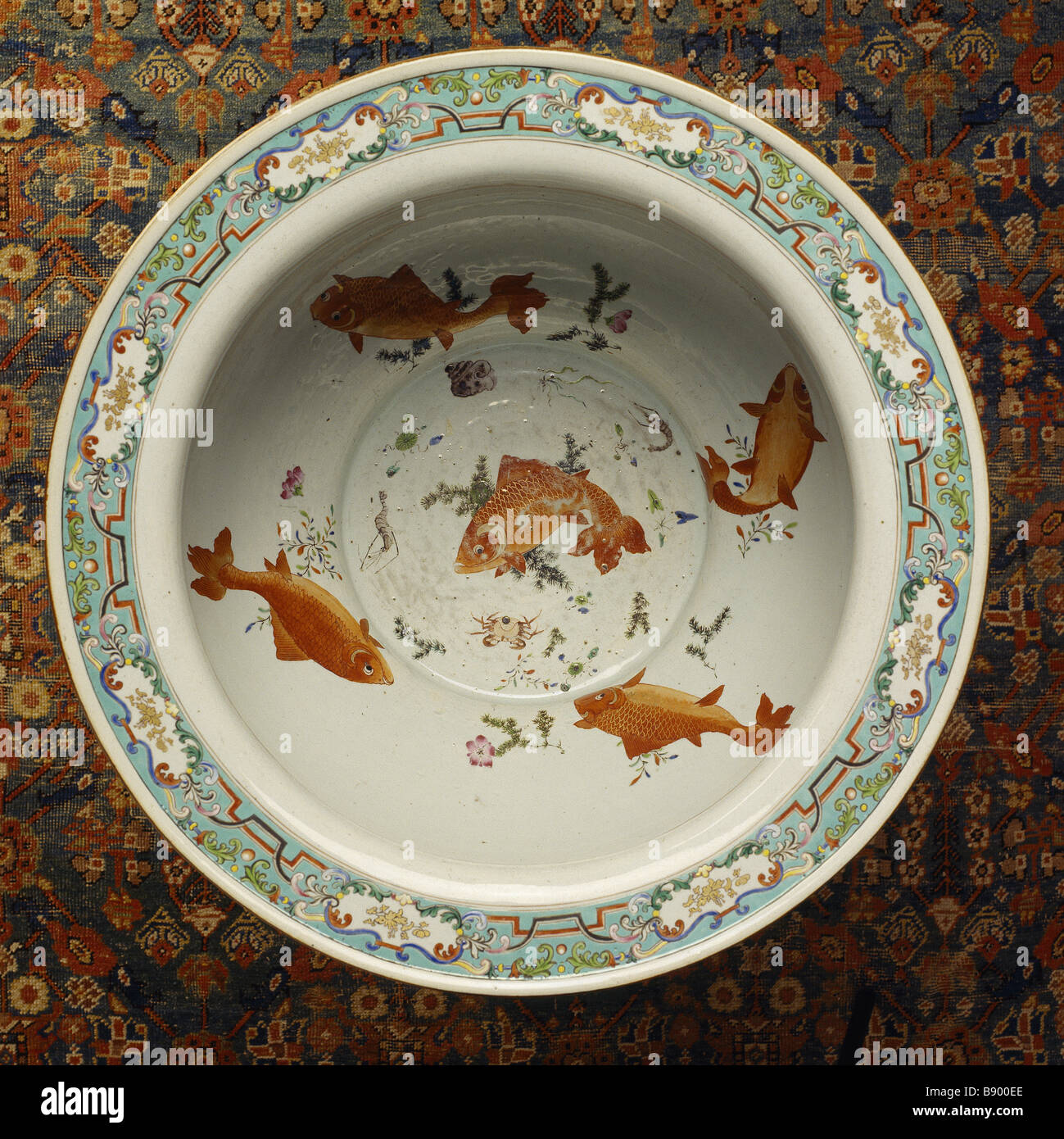 A ceramic dish with goldfish painted on the inside at Wallington (National Trust) Stock Photo