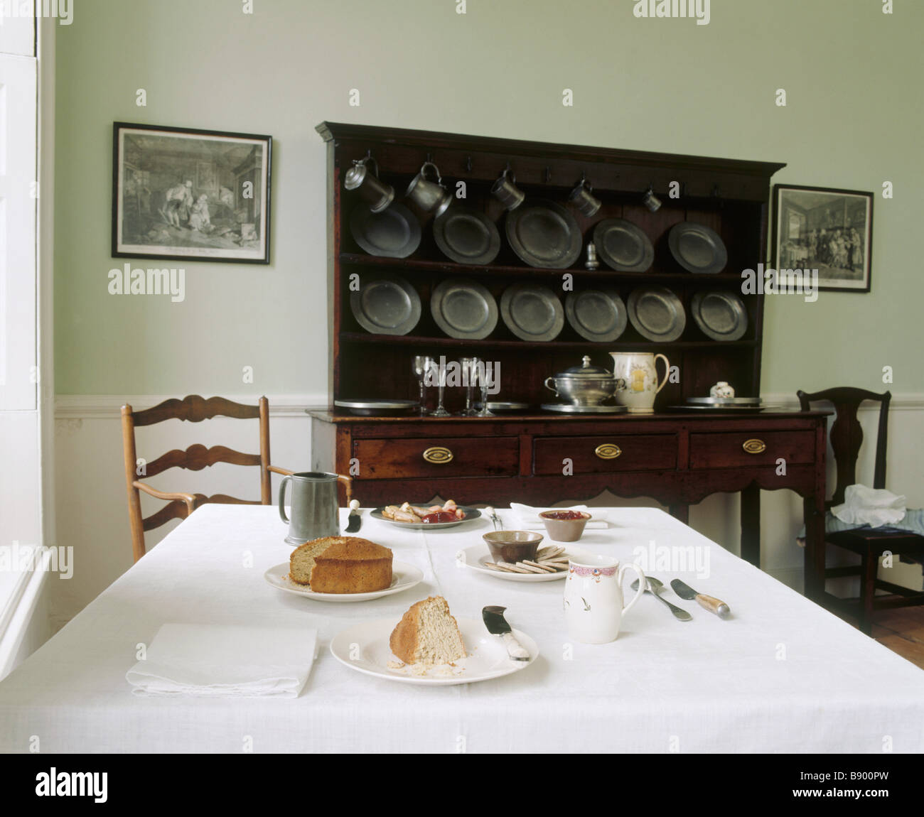 The Common Parlour at Wordsworths House with the table laid with tea and cakes and the dresser behind Stock Photo