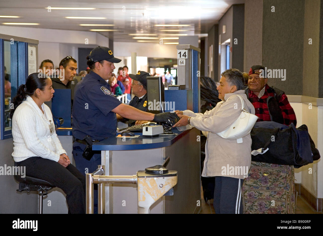 Immigrants show identification to enter the U S port of entry at the Tijuana Baja Mexico San Diego California border Stock Photo