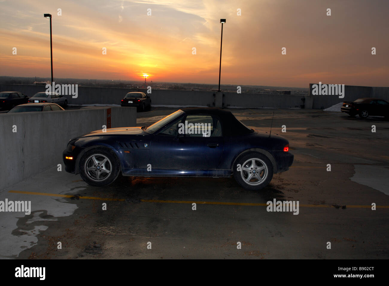 BMW sports car convertible with sunset in background Stock Photo