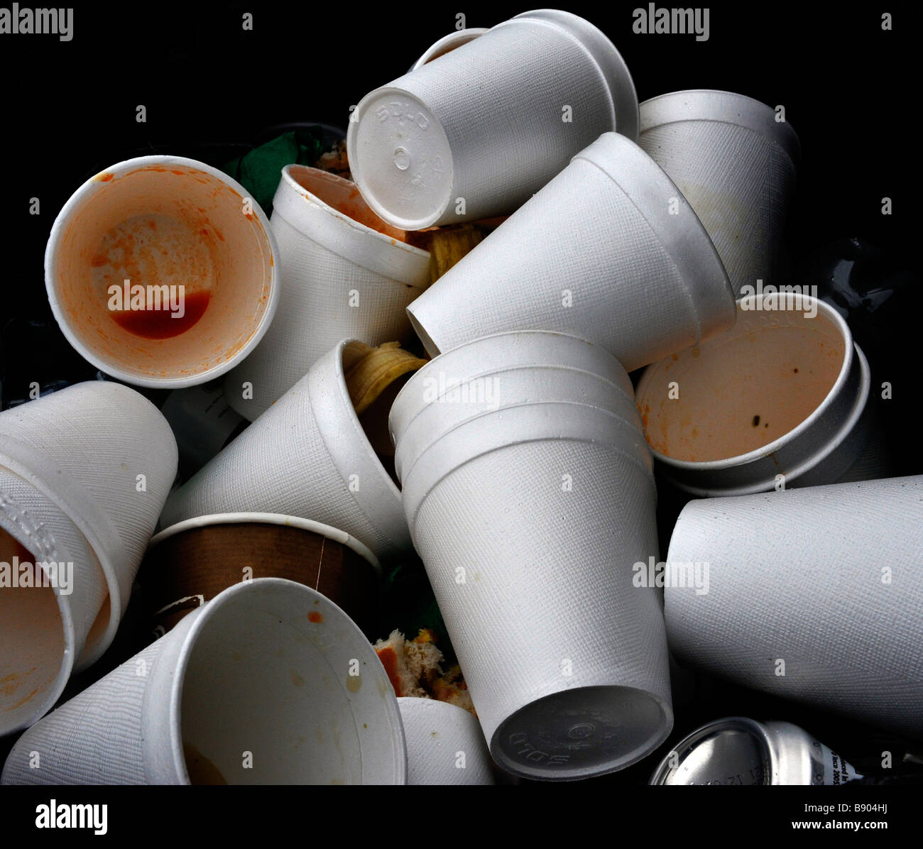 digarded polystyrene drinking cups in rubbish bin Stock Photo