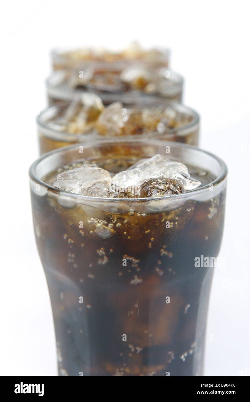Glasses of cola isolated against a white background Stock Photo - Alamy