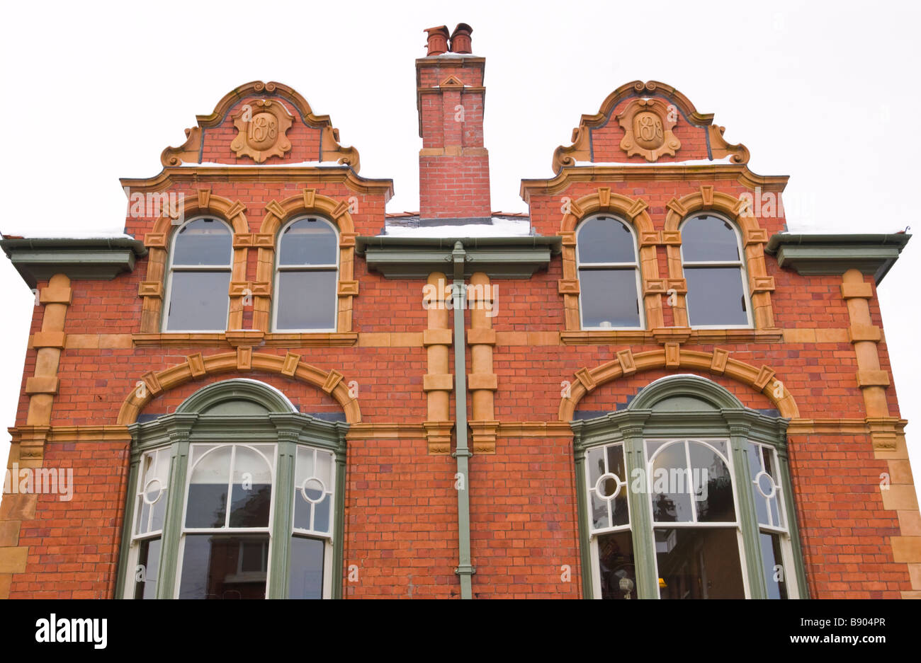 Building dated 1898 with Dutch Gable roof line on Middleton Street Llandrindod Wells Powys Mid Wales UK Stock Photo