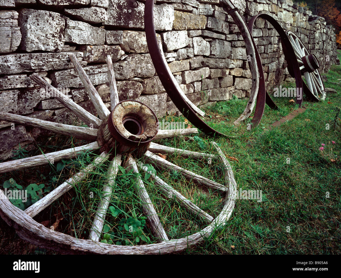 Wagon wheels against a wall at Fayette State Park in Michigan. Stock Photo