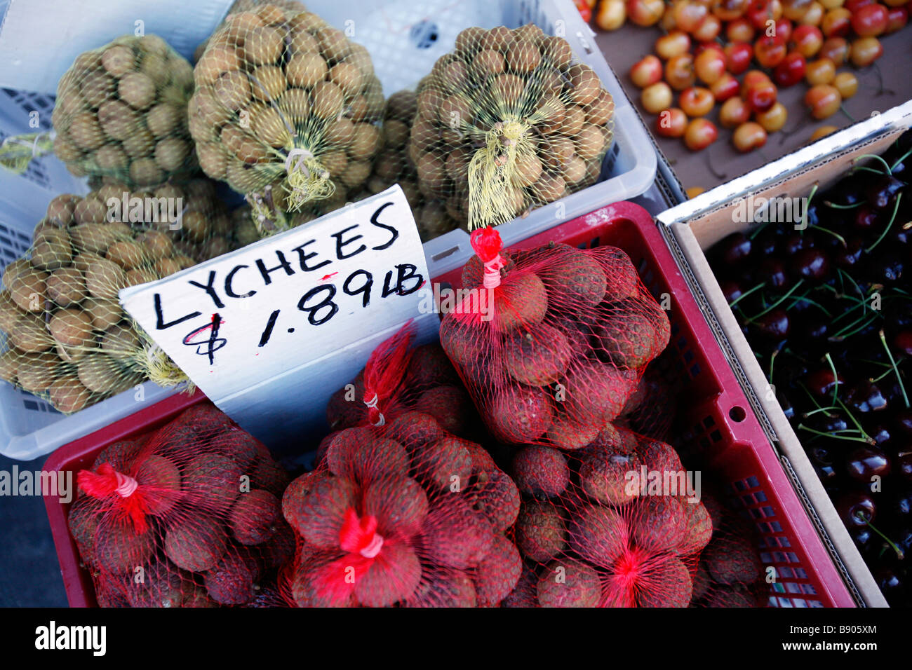 Lychee nuts and cherries for sale at a street market in Chinatown in