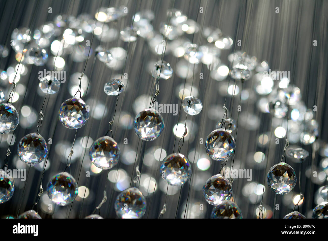 ceiling chandelier crystal glass baubles light illuminate illumination sparkle shiny glass crystal texture background tiered Stock Photo