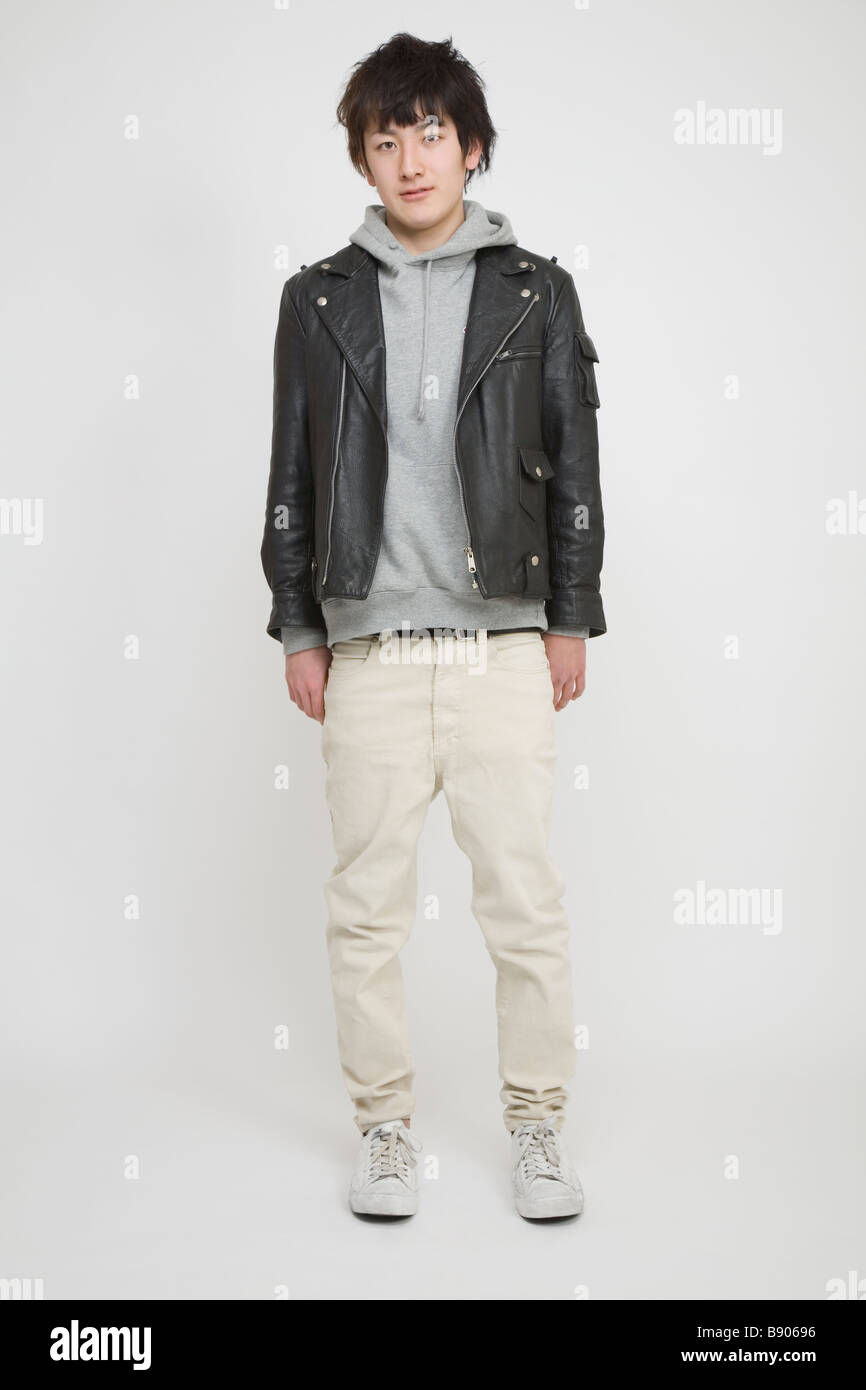Portrait of a young man standing Stock Photo - Alamy