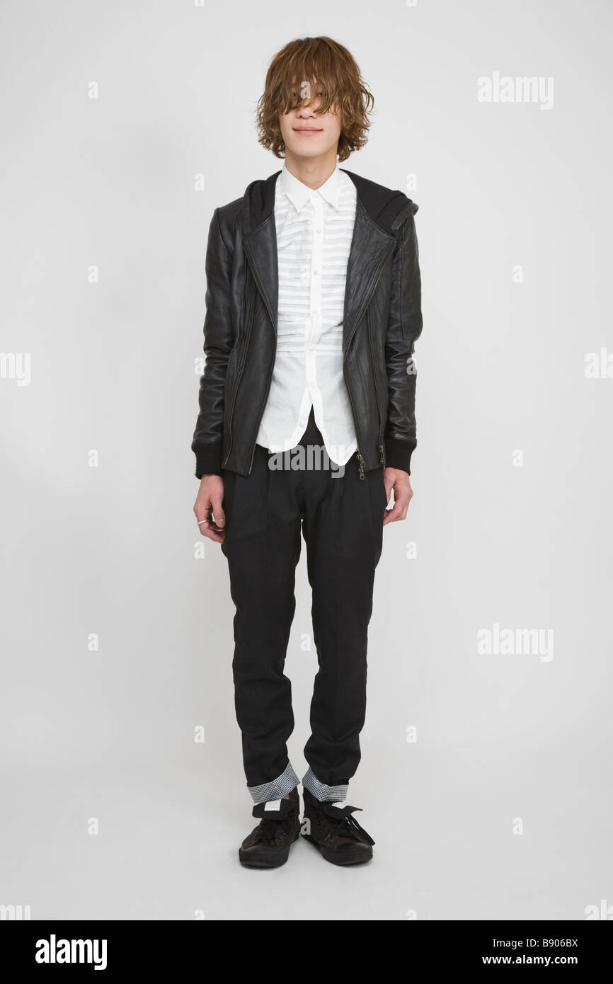 Portrait of a young man standing Stock Photo - Alamy