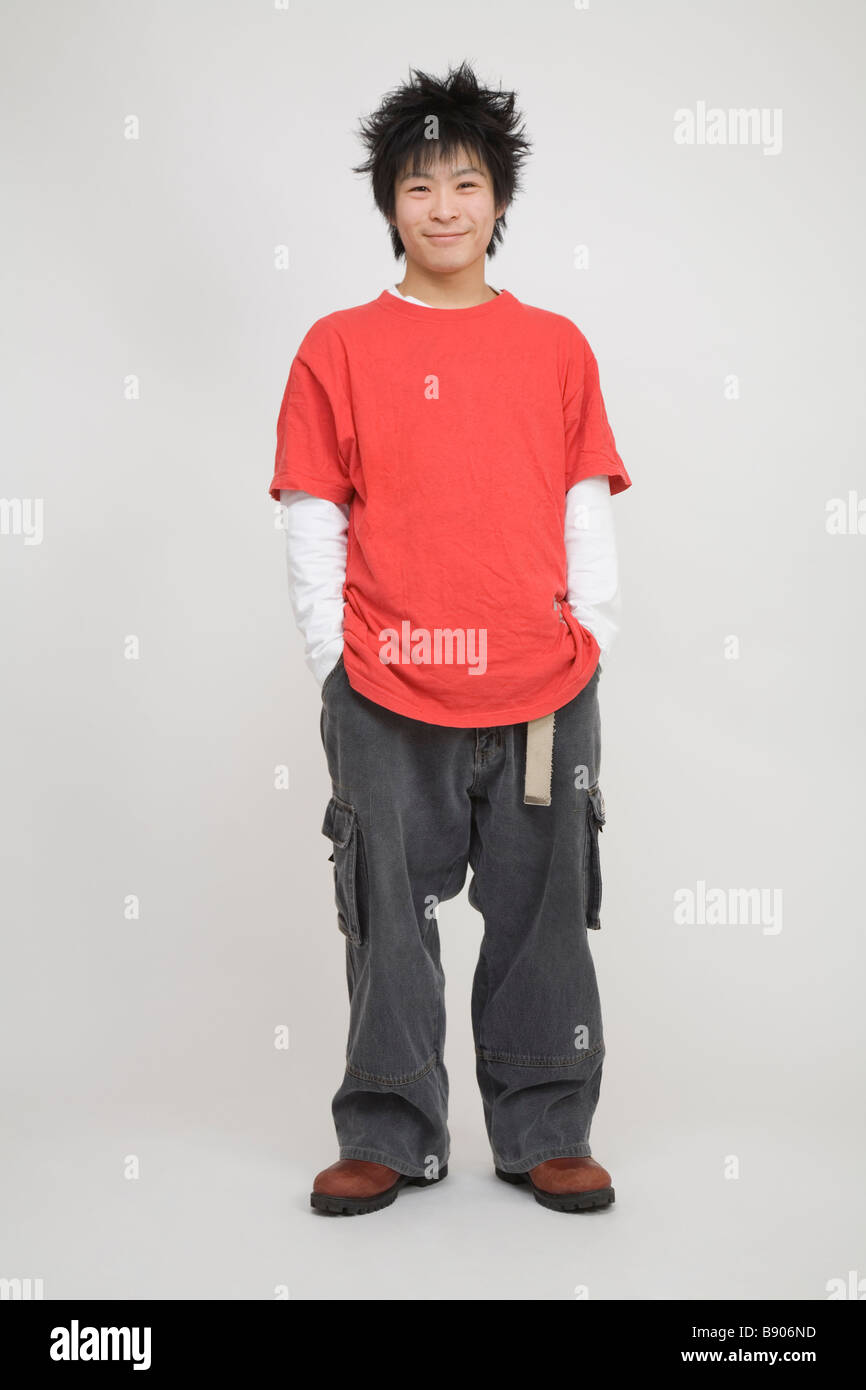 Portrait of a young man standing Stock Photo - Alamy