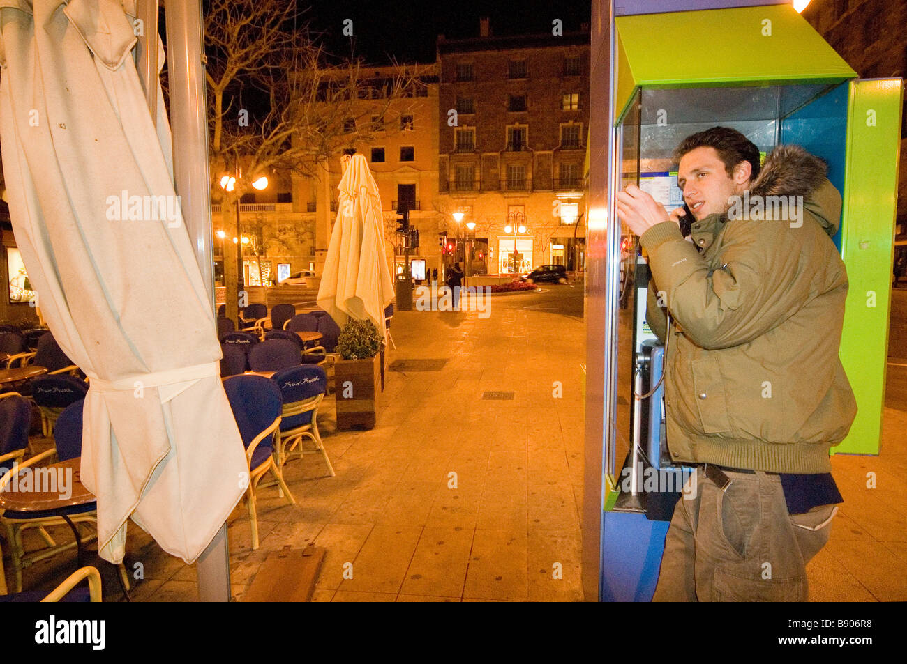 Europe Spain Balearic Islands Majorca Palma young man using a public phone Stock Photo