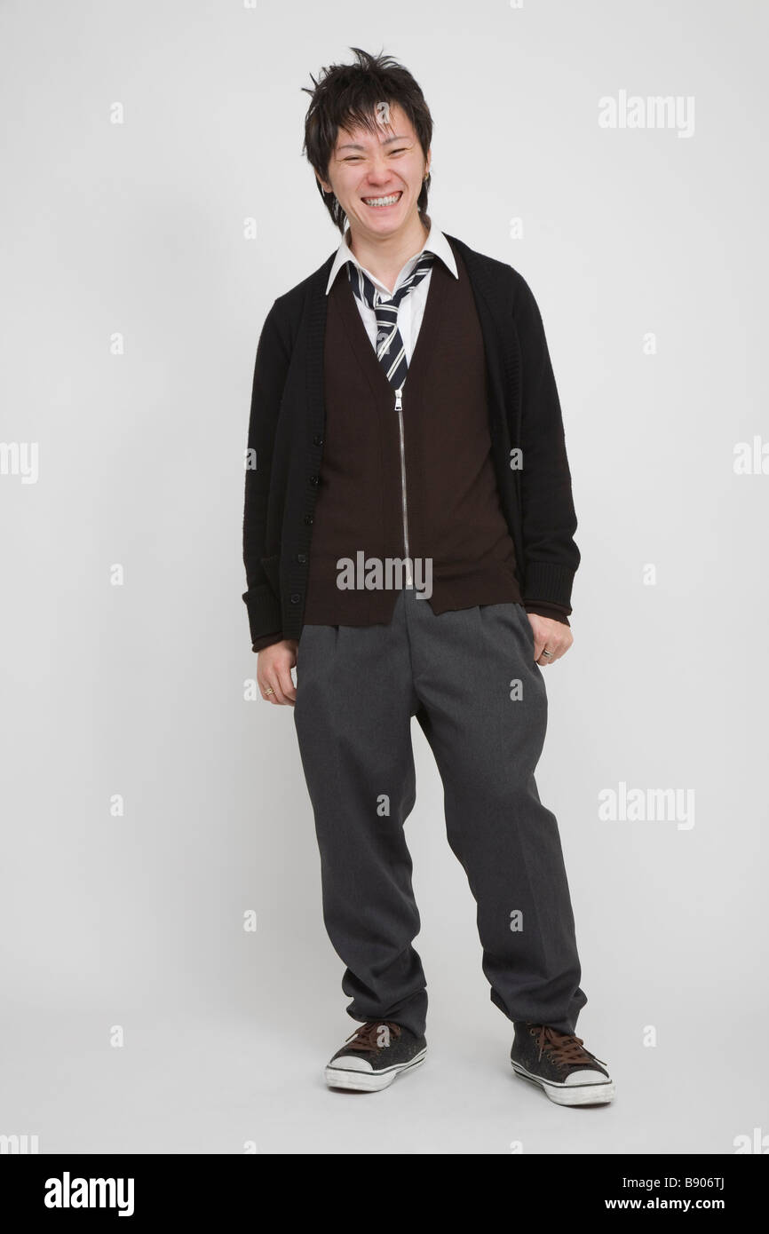 Portrait of a young man standing Stock Photo - Alamy