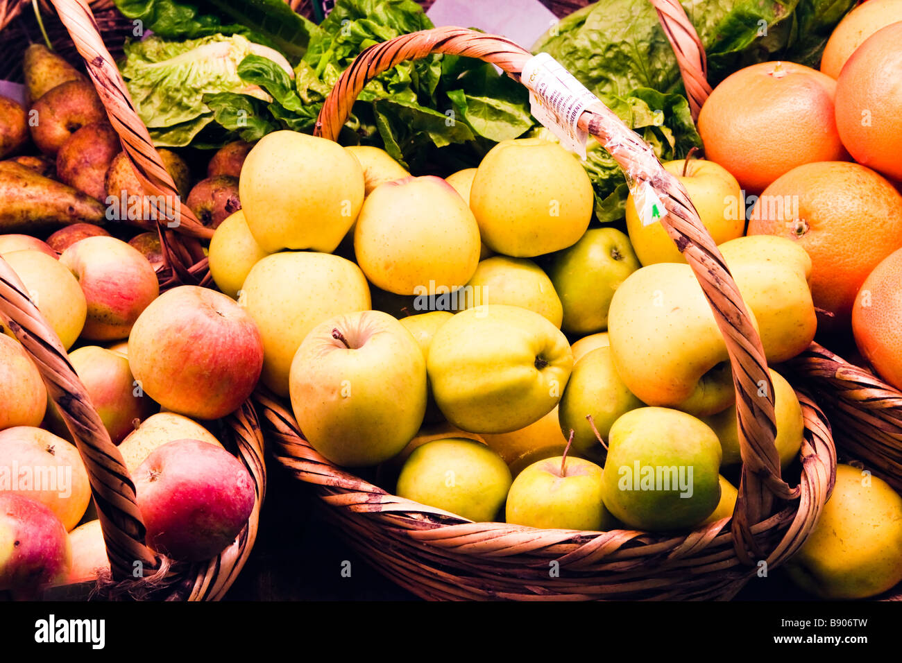 Baskets of ecologically grown fruit for sale in health shop Stock Photo