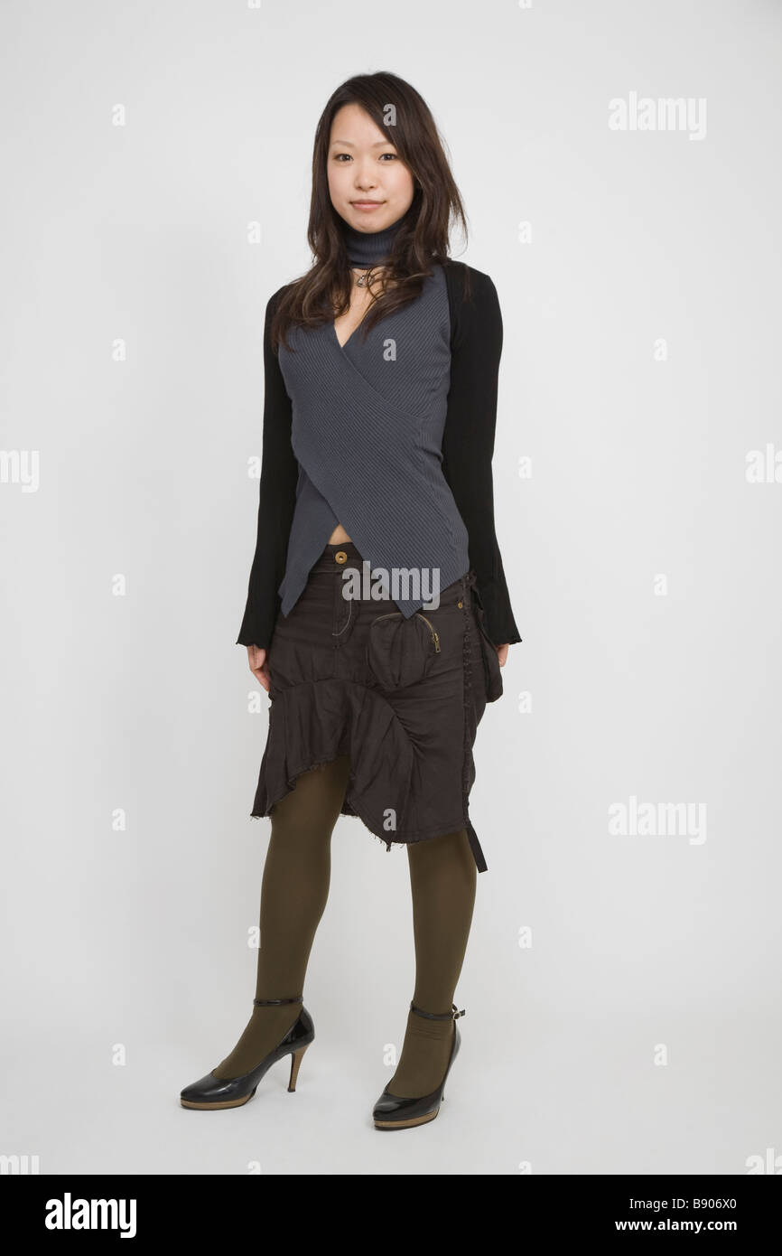 Smiling japanese woman standing hi-res stock photography and images - Alamy