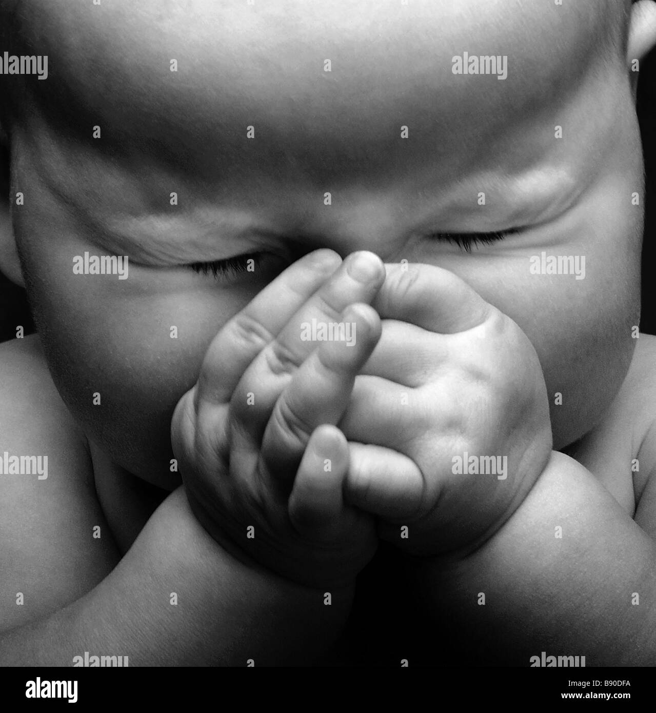 FL2480, NICK KELSH; Baby hands cupped over face Stock Photo Alamy