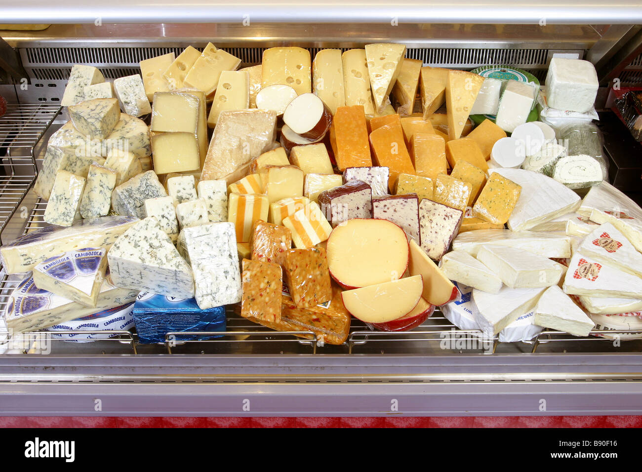 cheese display on supermarket counter Stock Photo Alamy