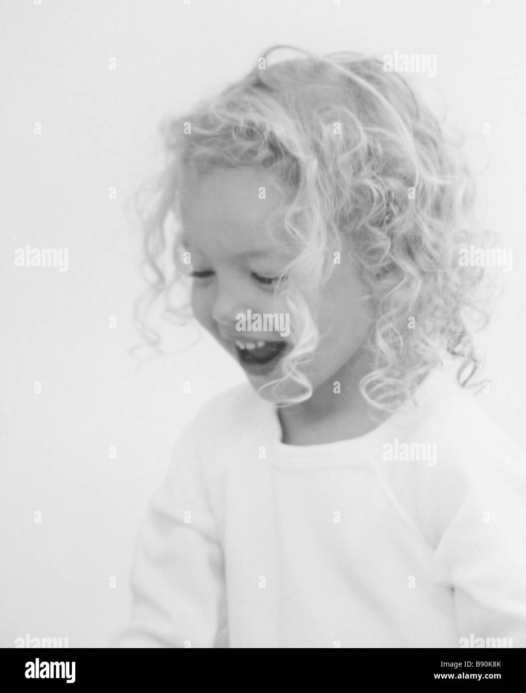 FL6079, Silver Parrot Studio; Young Girl Curly Blonde Hair Laughing Stock Photo