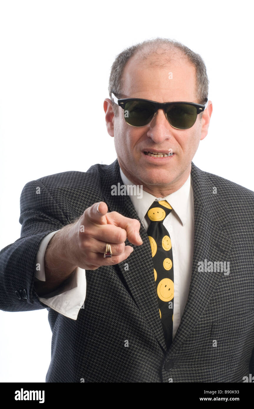 angry mad threatening corporate business senior executive wearing retro vintage fashion sunglasse portrait tough guy Stock Photo