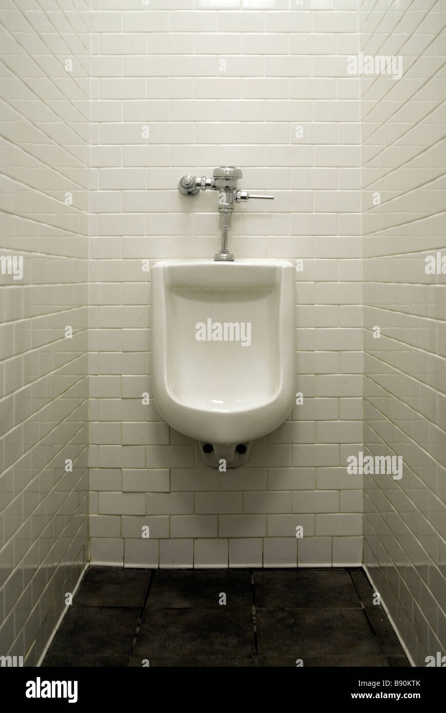 Urinal in mens restroom Stock Photo - Alamy