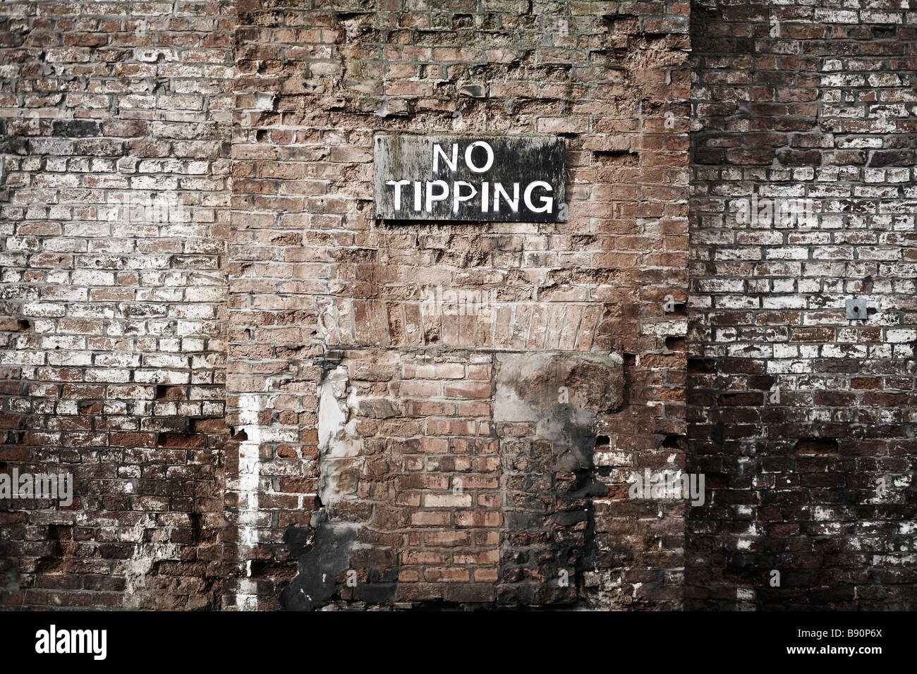 derelict building in down town liverpool with 'no tipping' sign Stock Photo