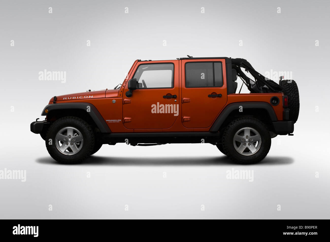 2009 Jeep Wrangler Unlimited Rubicon in Orange - Drivers Side Profile Stock  Photo - Alamy