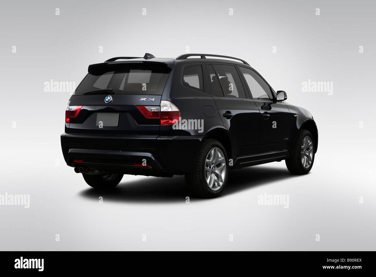 2009 BMW X3 3.0i in Blue - Rear angle view Stock Photo