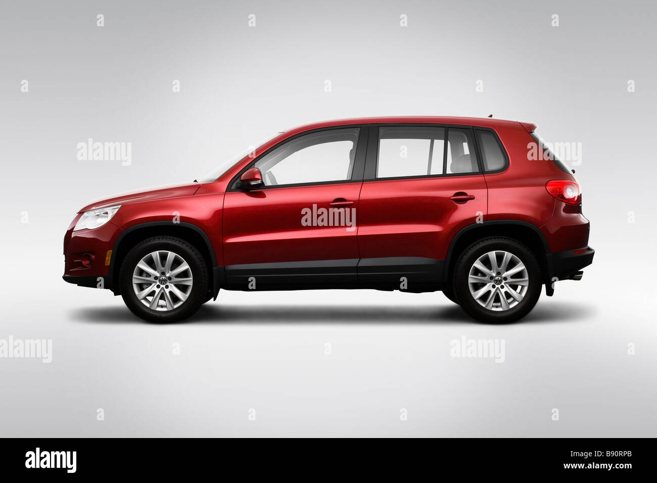 2009 Volkswagen Tiguan S in Red - Drivers Side Profile Stock Photo