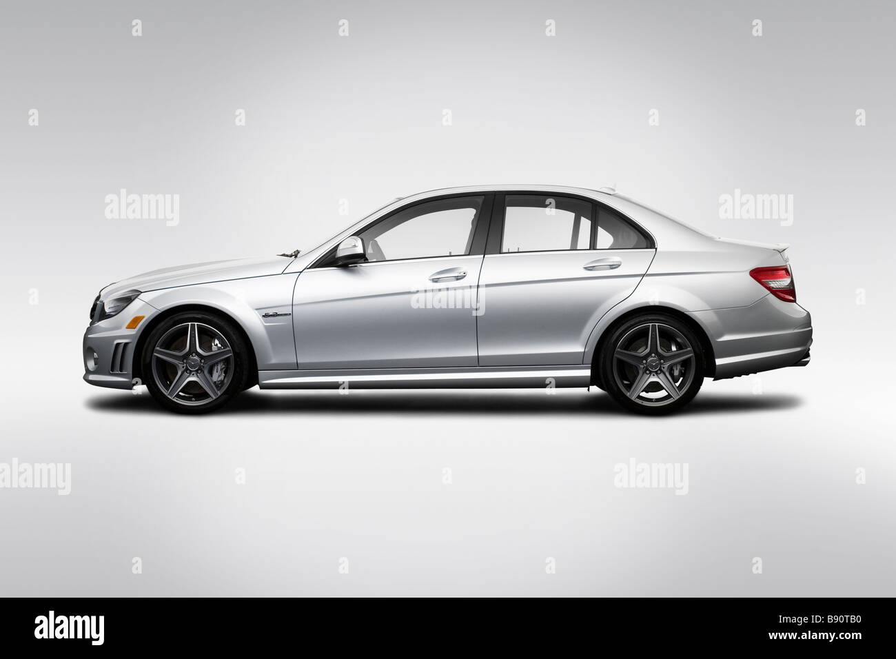 2009 Mercedes-Benz C-Class C63 AMG in Silver - Drivers Side Profile Stock Photo