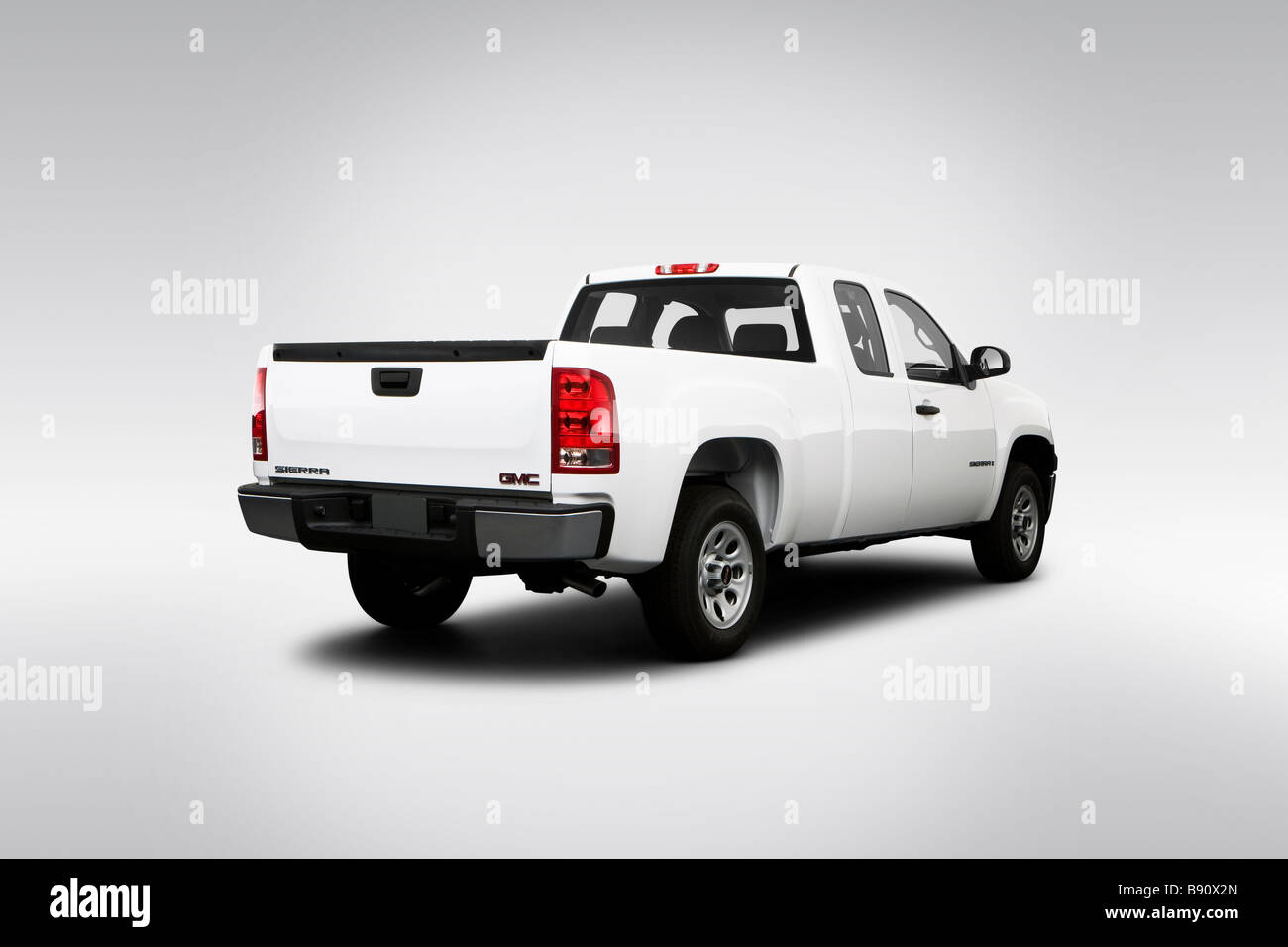 2009 GMC Sierra in White - Rear angle view Stock Photo