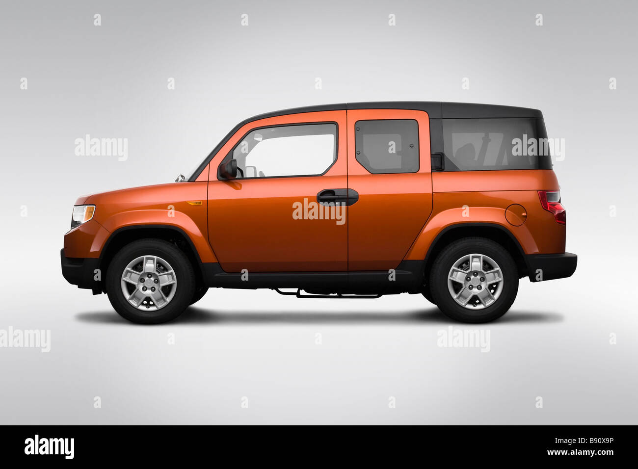 2009 Honda Element LX in Orange - Drivers Side Profile - Stock Image