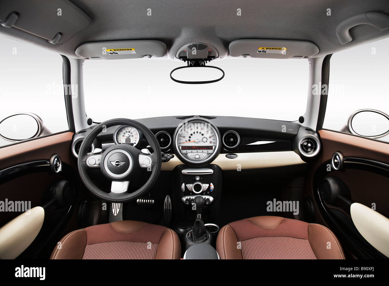 2009 Mini Cooper Clubman S in Beige - Dashboard, center console, gear shifter view Stock Photo