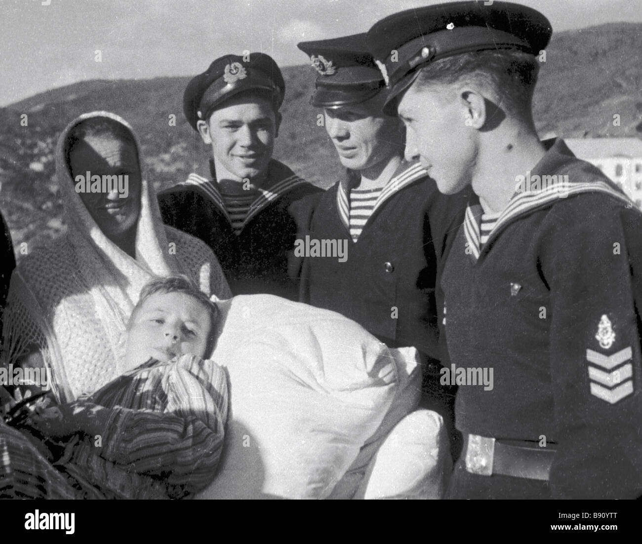 Sailors Standing Near A Sick Boy In The Film A Day From Our Life Stock Photo Alamy