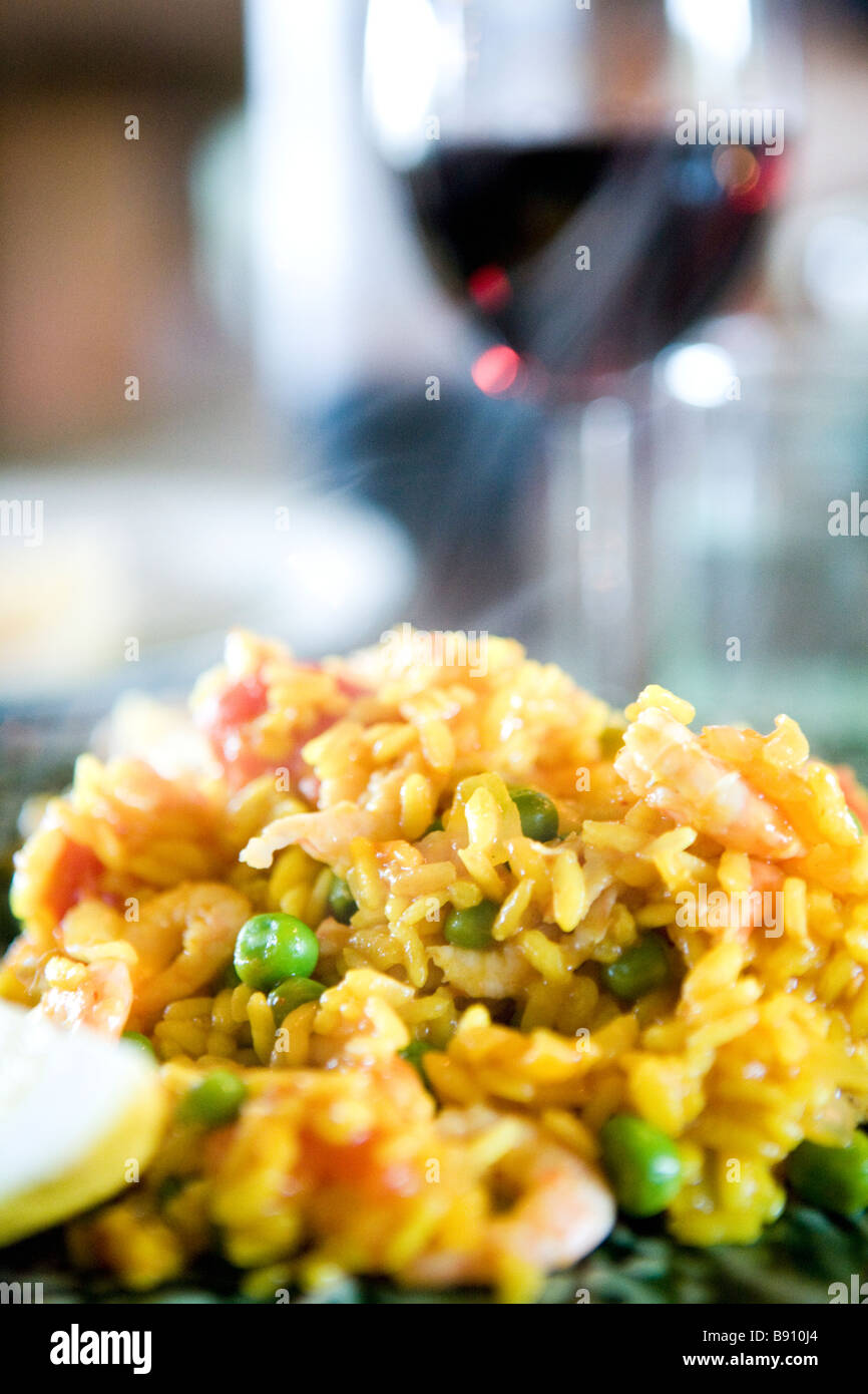 Paella and a glass of red wine Stock Photo Alamy