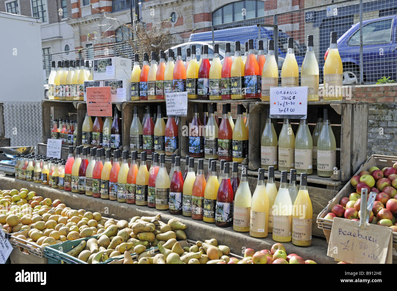 Bottles of organic juice on sale at Marylebone Farmers Market London England UK Stock Photo