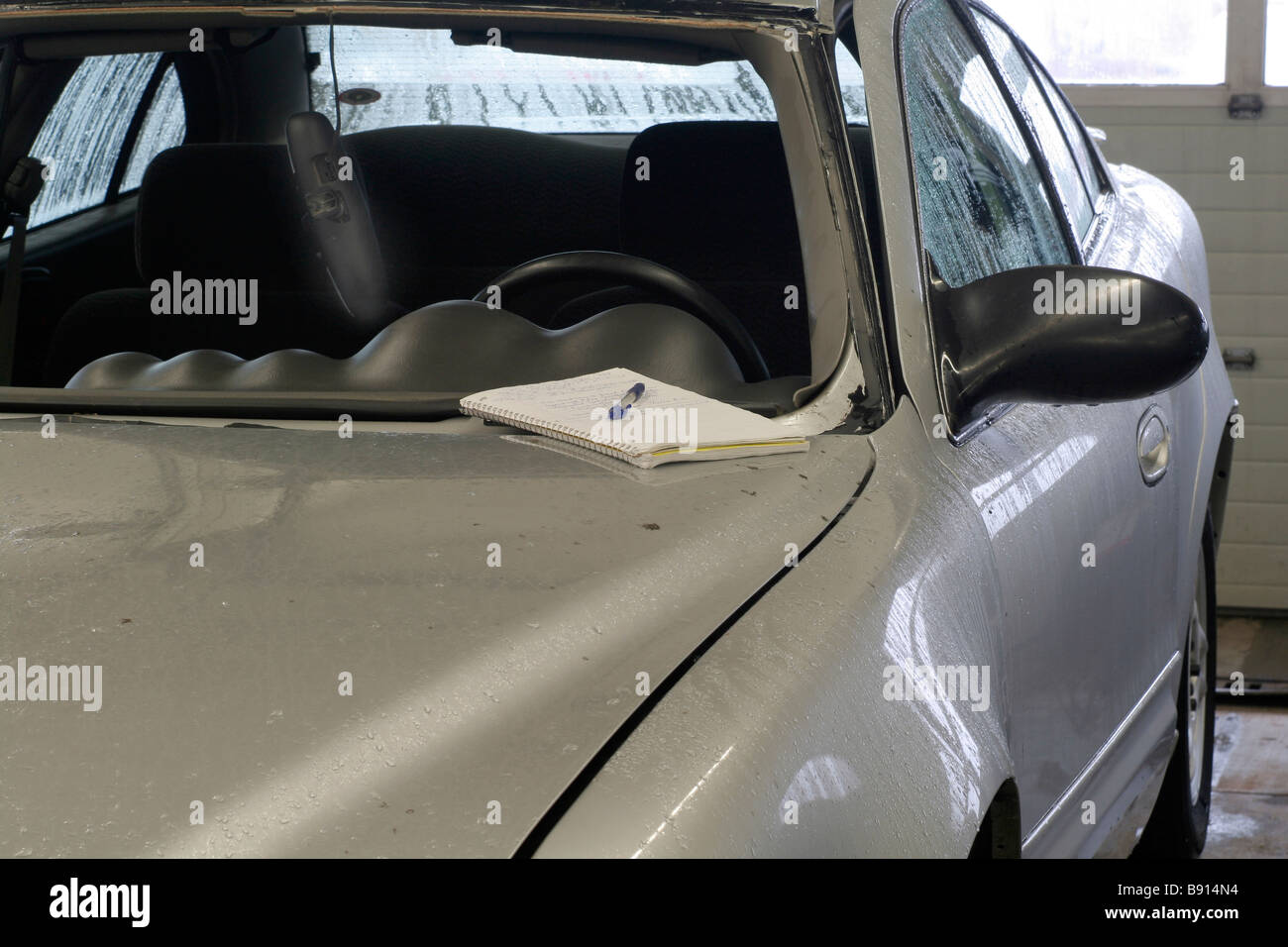 Insurance estimate for replacement of windshield in shop Stock Photo