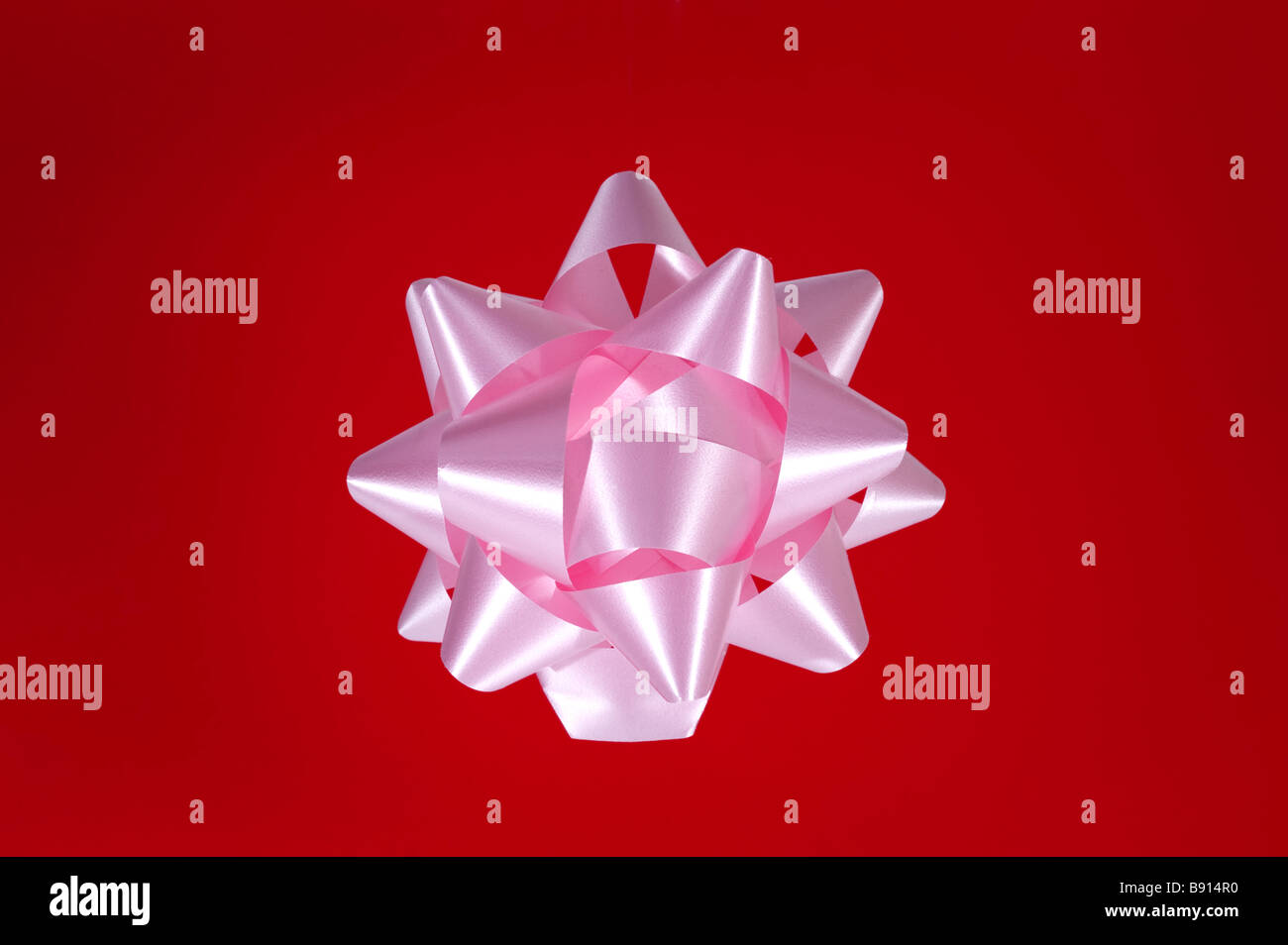 Large pink gift wrap bow Stock Photo Alamy