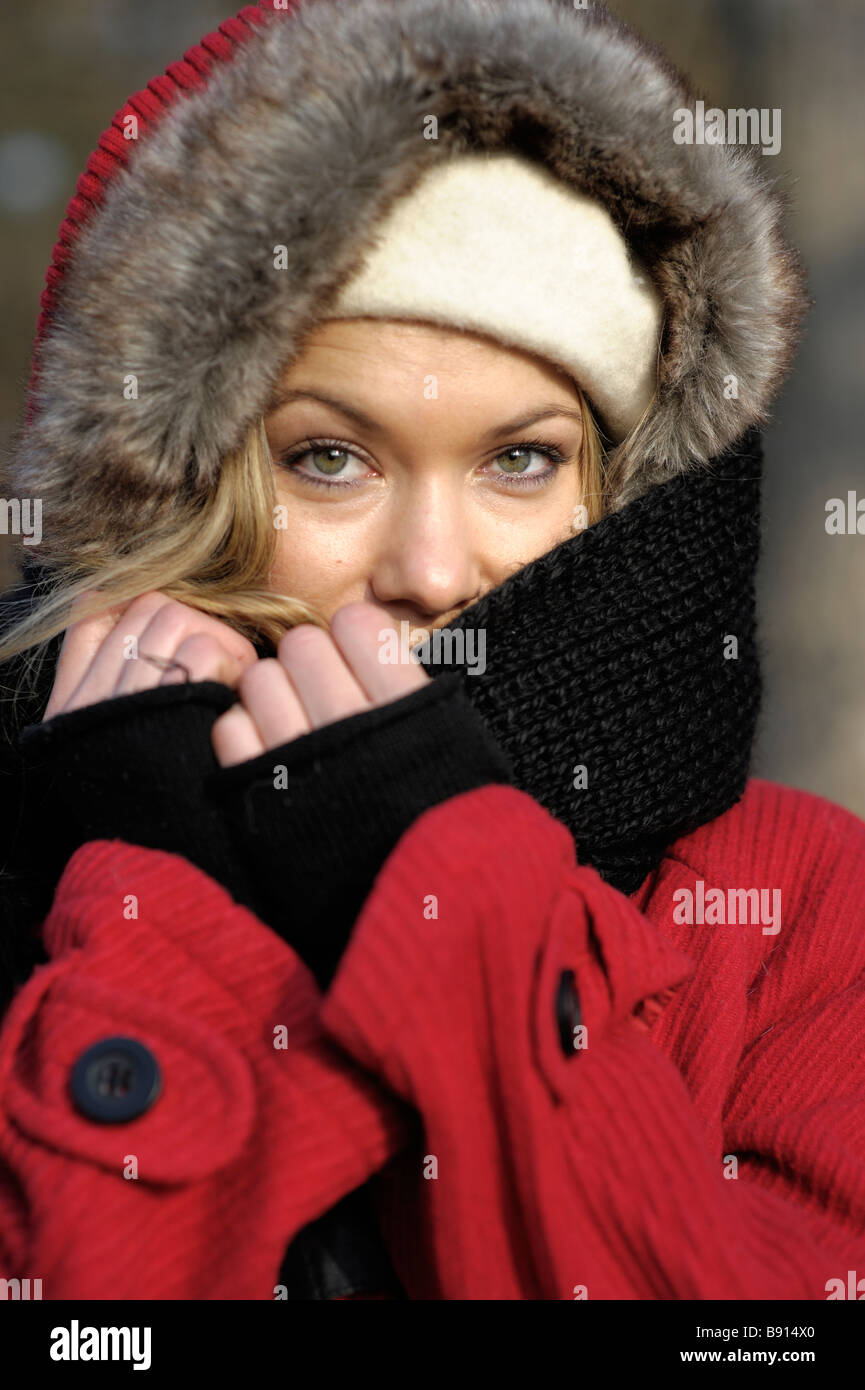 Beautiful Woman keeping herself warm. Stock Photo