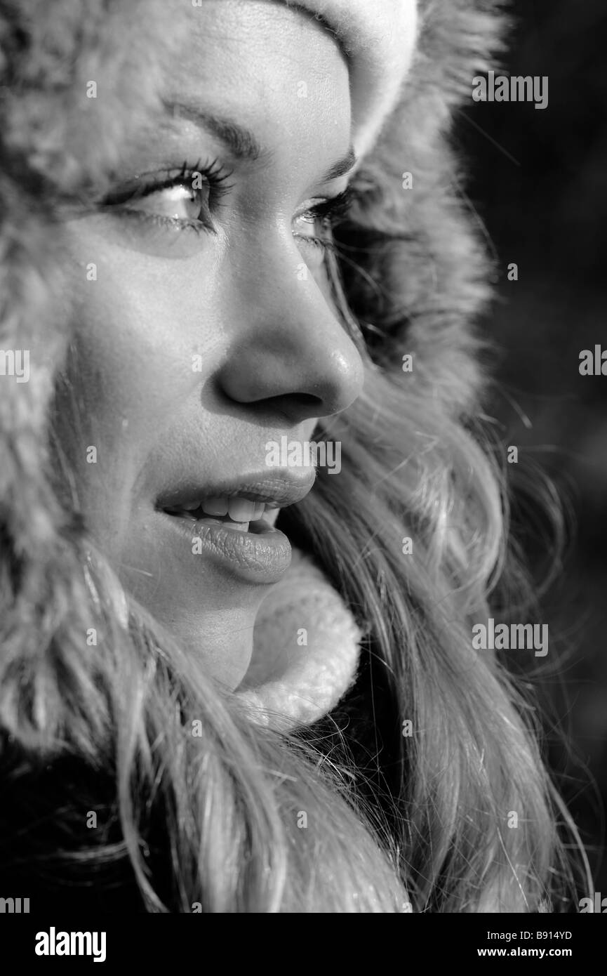 Portrait of a Woman looking into the Light in Winter BW Stock Photo