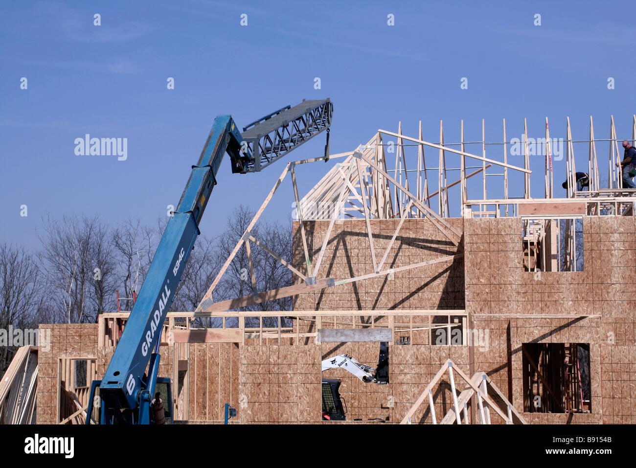 Setting rafter trusses on new construction Stock Photo
