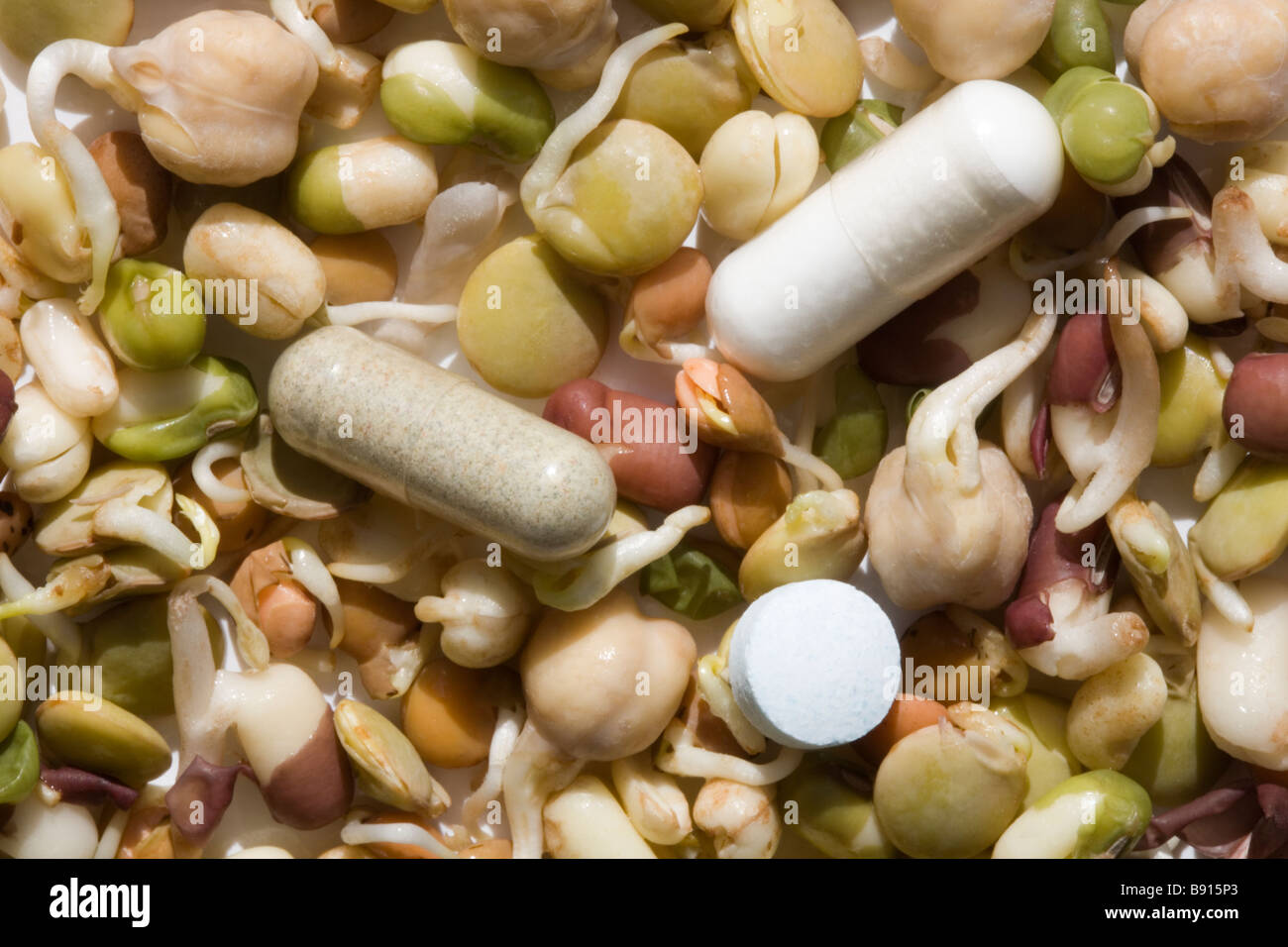Healthy eating bean sprouts versus pills, capsules and medicine Stock Photo