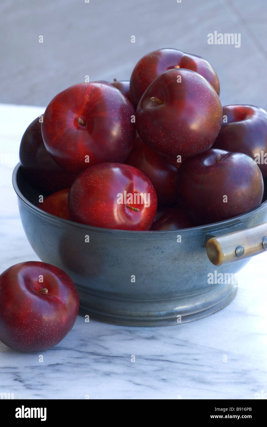 Plums in a bowl Stock Photo