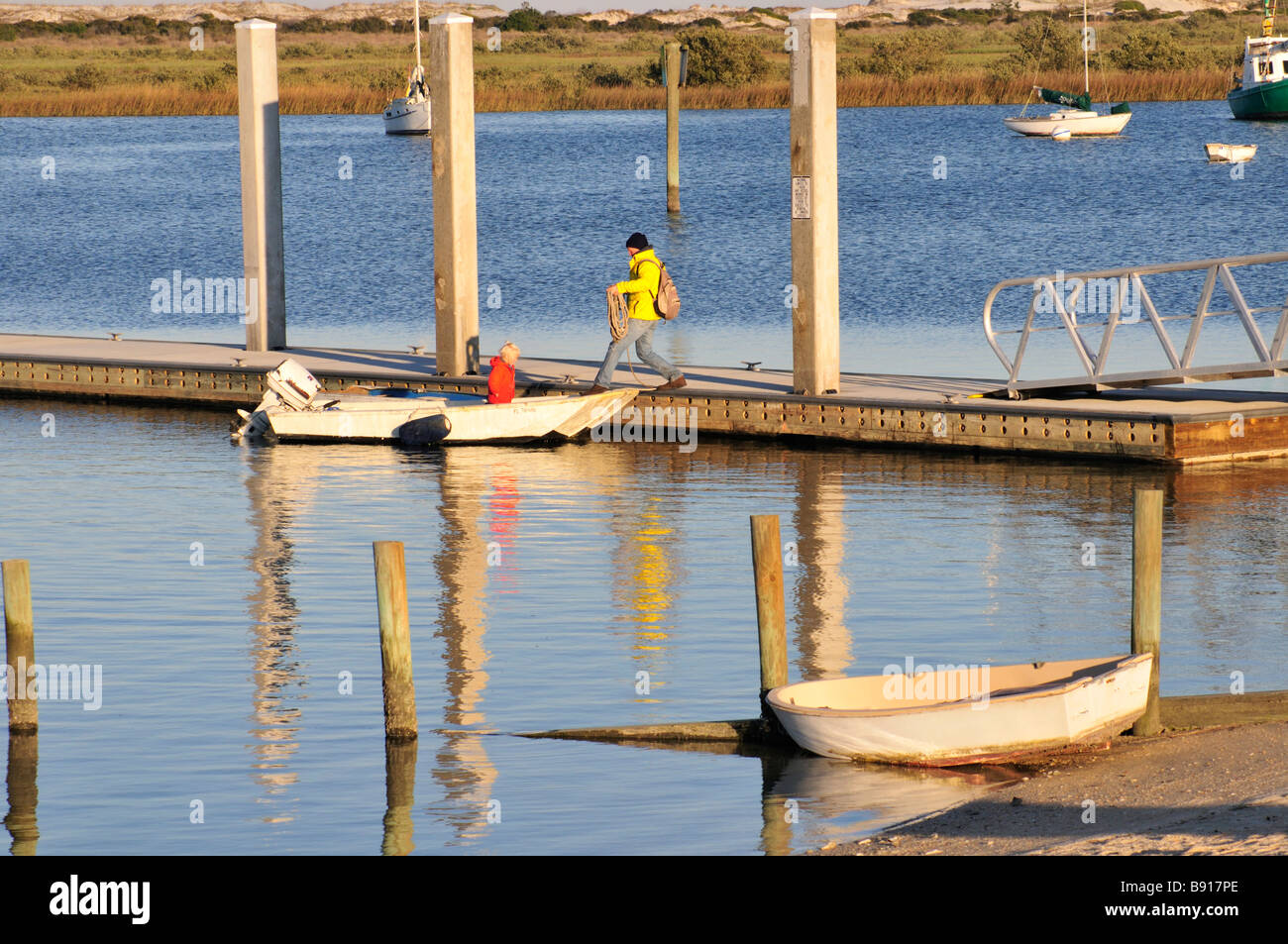 A father and son prepare to leave the dock at Lighthouse Park St