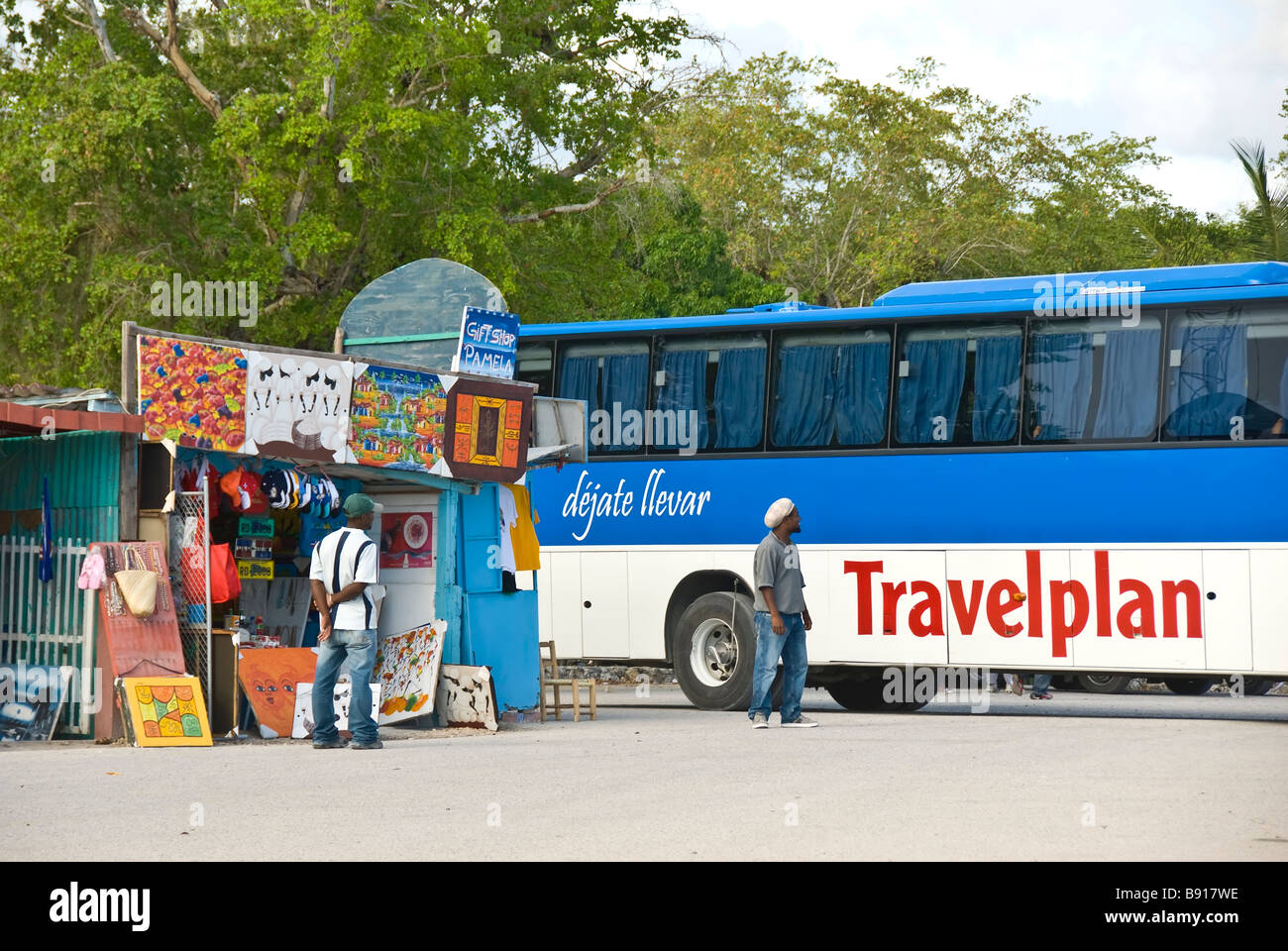 Tour bus at Bayahibe fishing village Dominican Republic southeast coast popular tourist destination for boat trips to Isla Saona Stock Photo