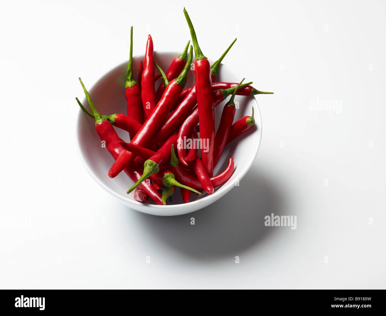 Bowl of fresh red chillies Stock Photo
