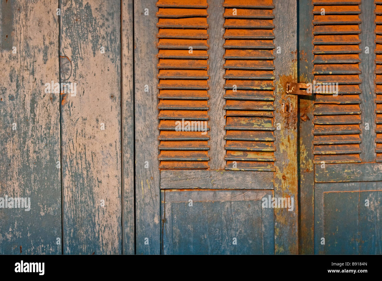 Weathered French colonial doors in Thakek, south eastern Laos Stock Photo