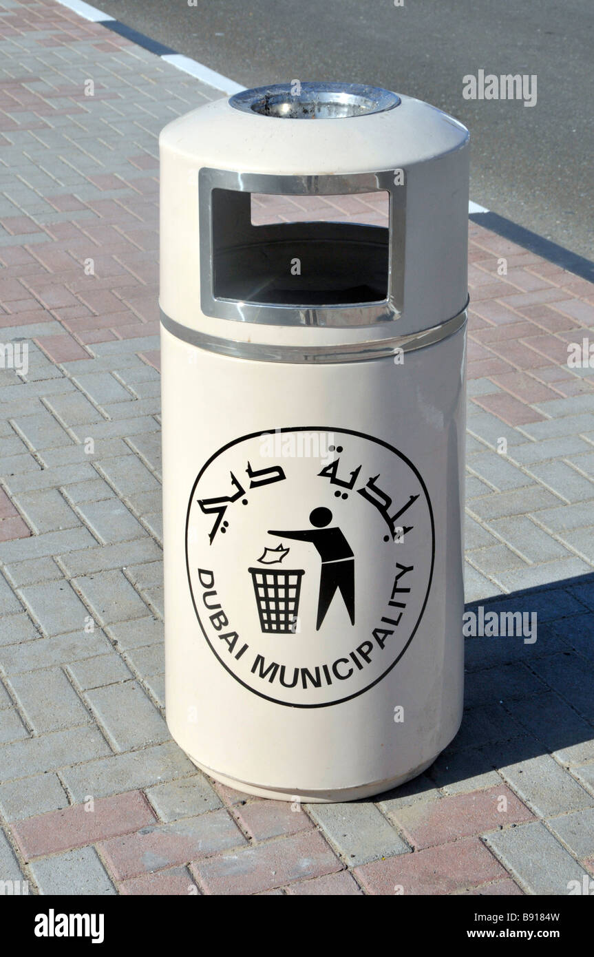 Litter bin with bilingual sign provided by Dubai Municipality Stock