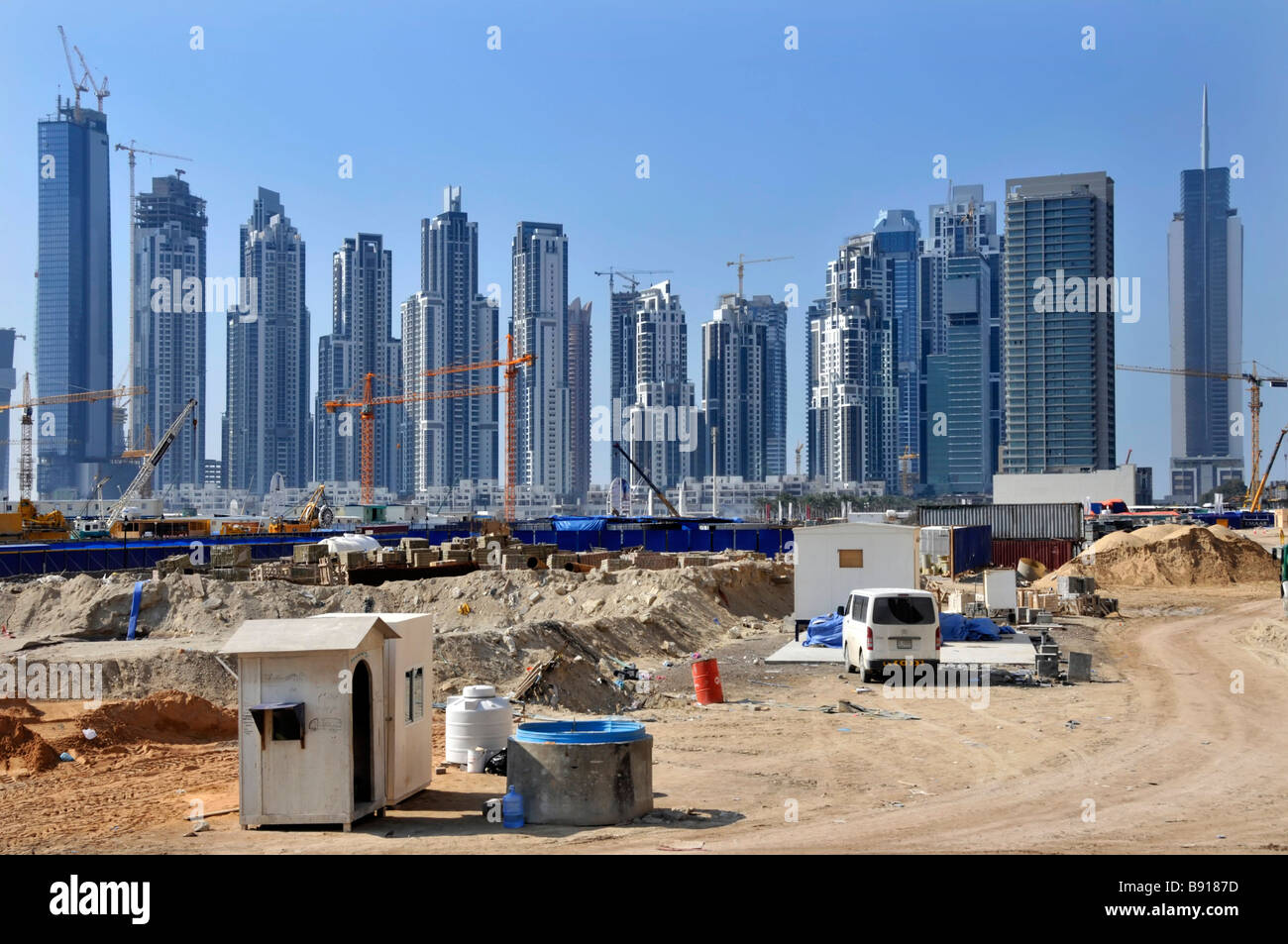 Dubai big construction building site with many high rise skyscrapers some completed some work in progress with cranes in Dubai UAE Middle East Asia Stock Photo