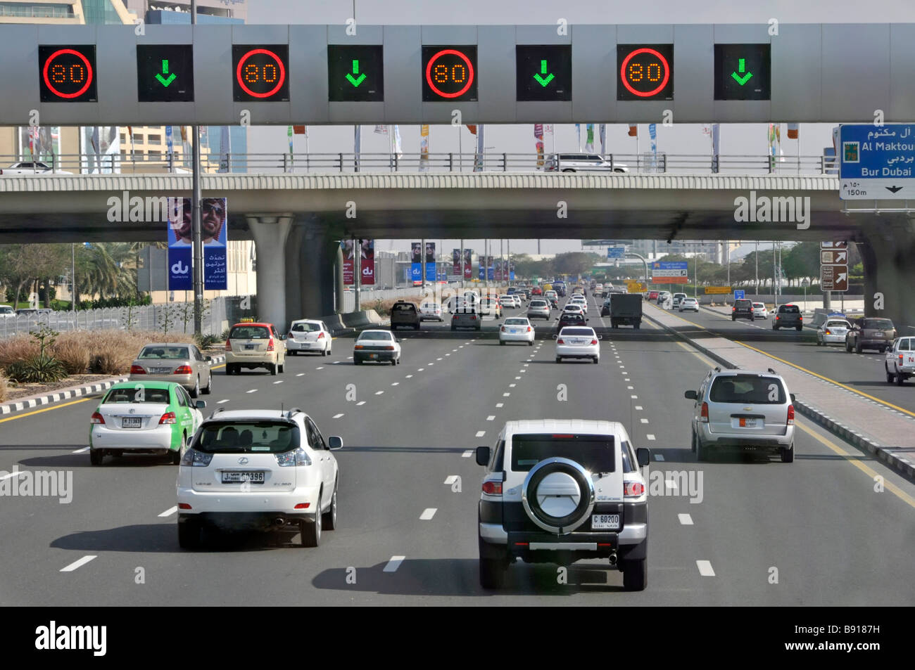 Looking down from above on Dubai car traffic modern five lane motorway