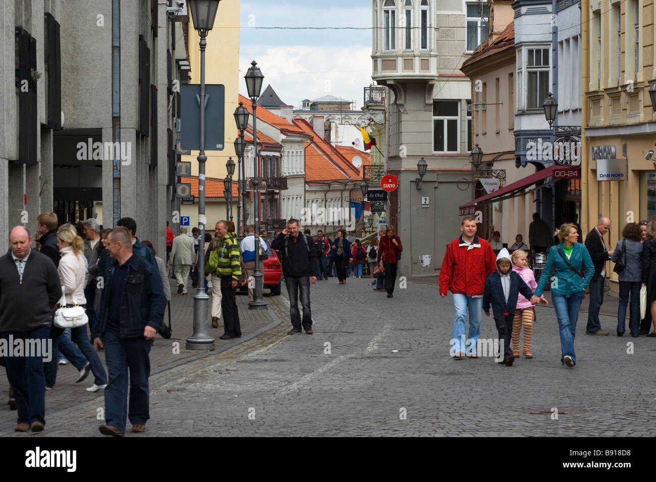 People walking along the street in Vilnius city centre Stock Photo