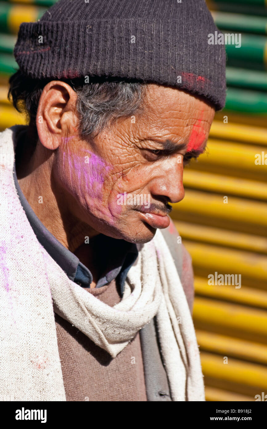 Kumoani man from the himalaya daubed in paint, part of the Holi celebrations in the old British hill station of Almora, India. Stock Photo